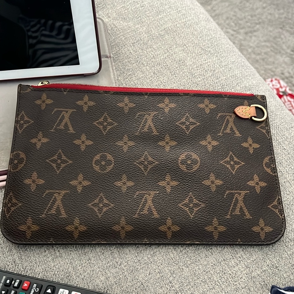 Authentic Louis Vuitton wristlet in great condition. Has no straps.